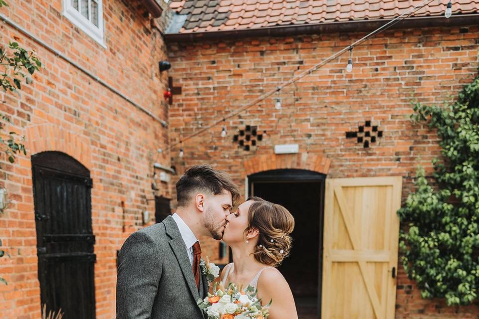 Bride and groom kissing