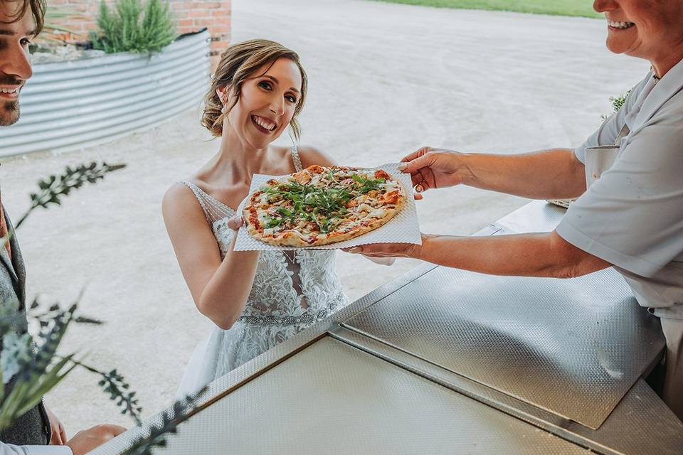 Bride with pizza