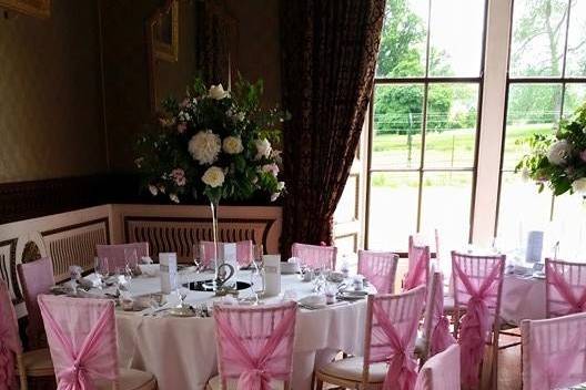 Limewash chair with pink ruffle hood