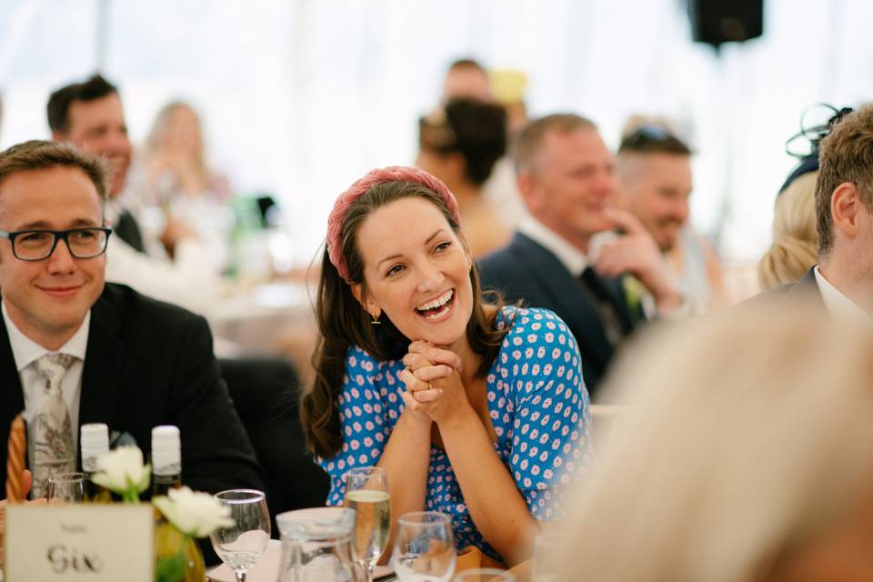 Guest laughing during speeches