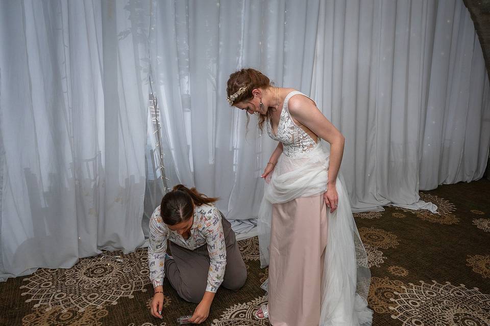 Me helping pin up Laura's dres
