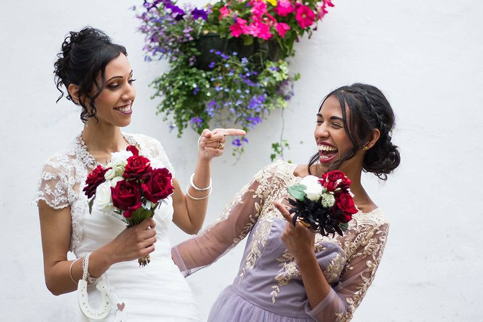 Laughing and holding bouquets