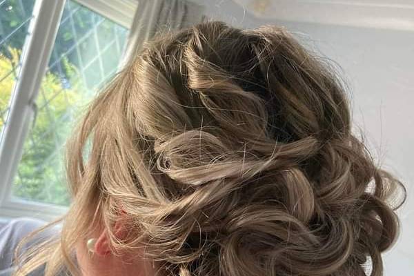 Voluminous curly updo