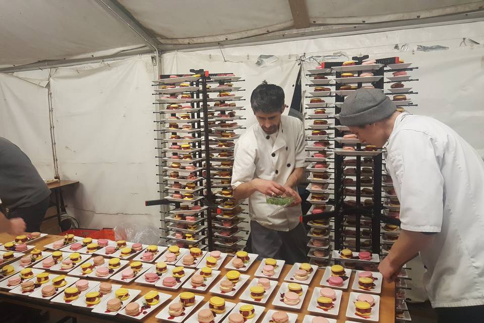 Chef plating under marquee