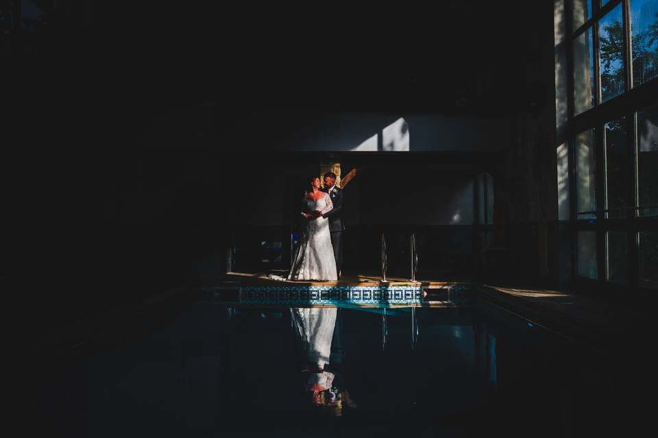 Bride and groom by the pool