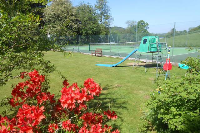 Tennis court and play area