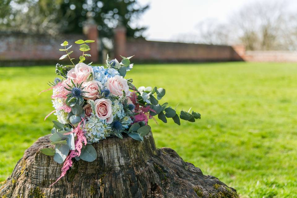 Blue Hydrangea, roses, and pink asparagus fern