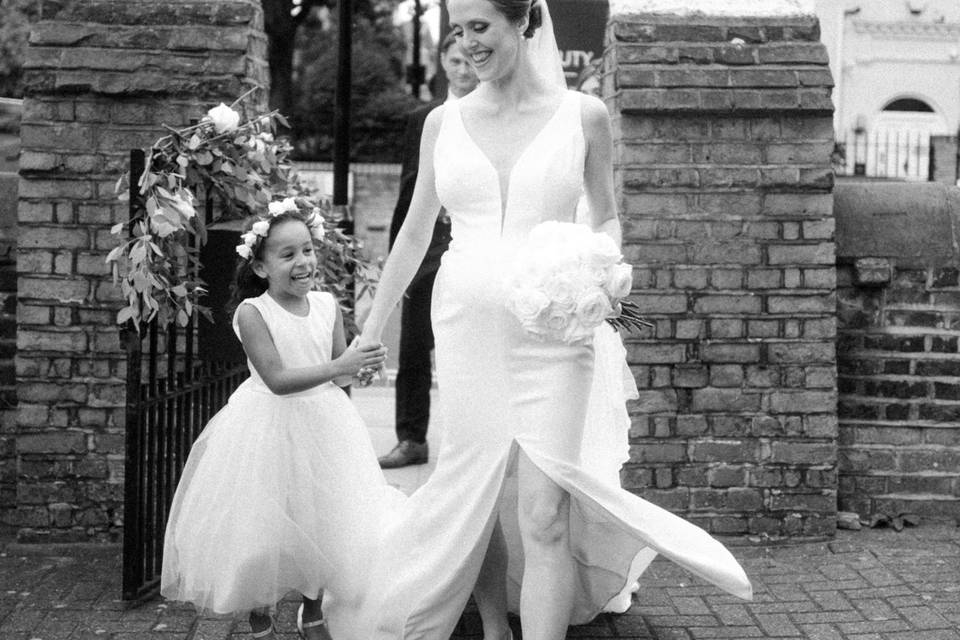 Bride walks with flower girl
