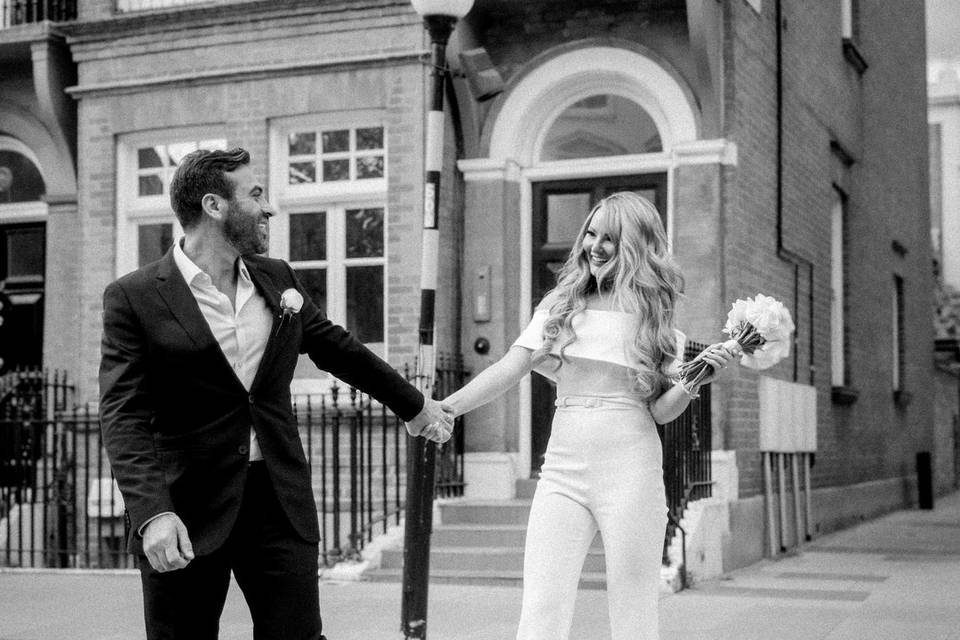 Bride and groom cross road