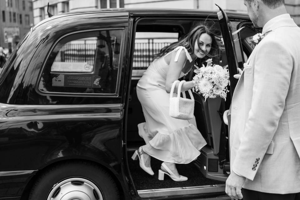 Bride gets in London Cab