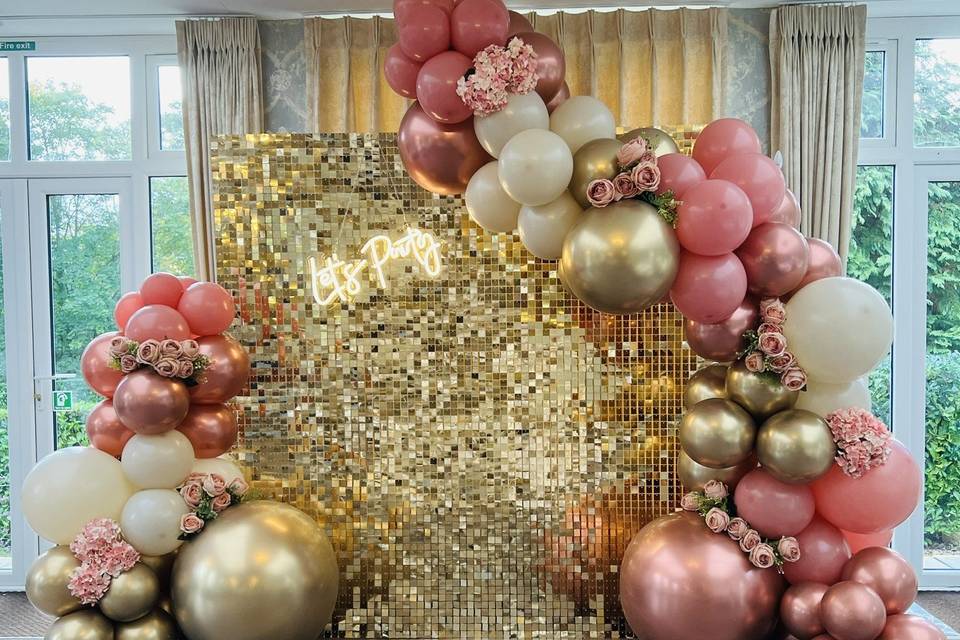 Gold shimmer wall and balloons