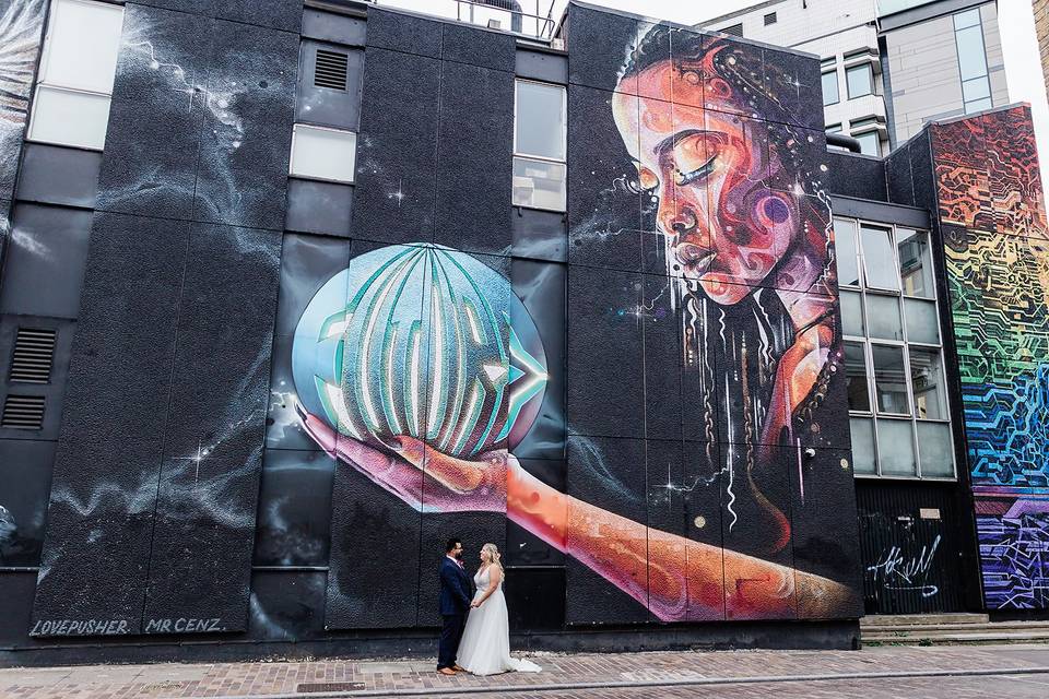 Couple by Graffiti wall