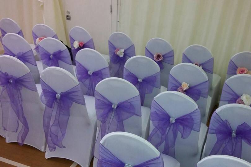 Chair covers, sash and flower