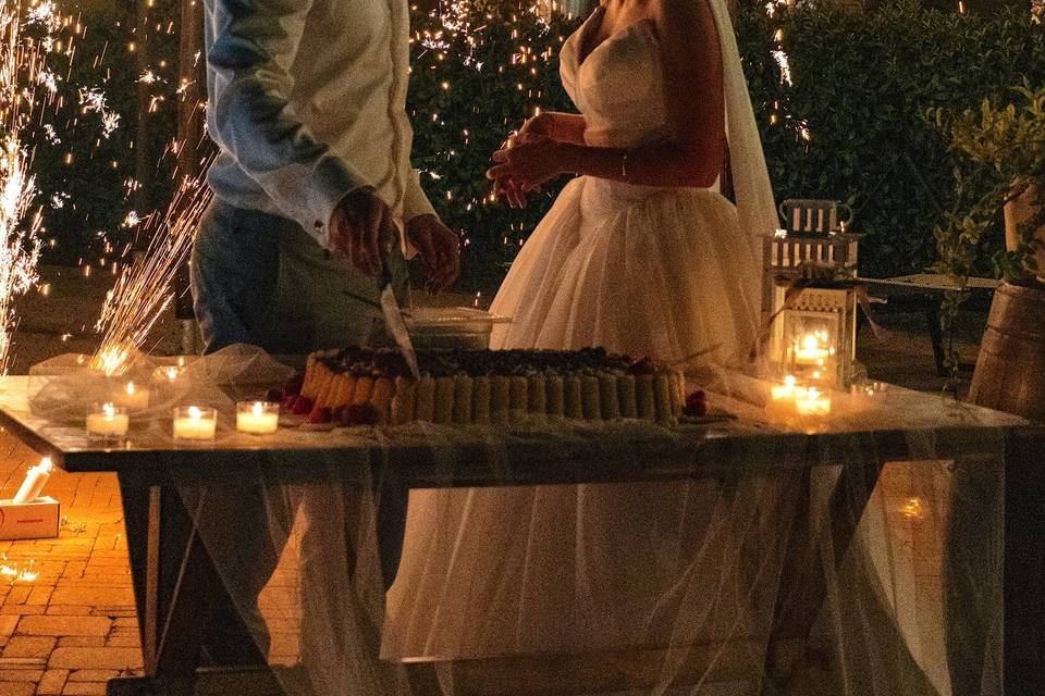 Wedding cake cutting at pool