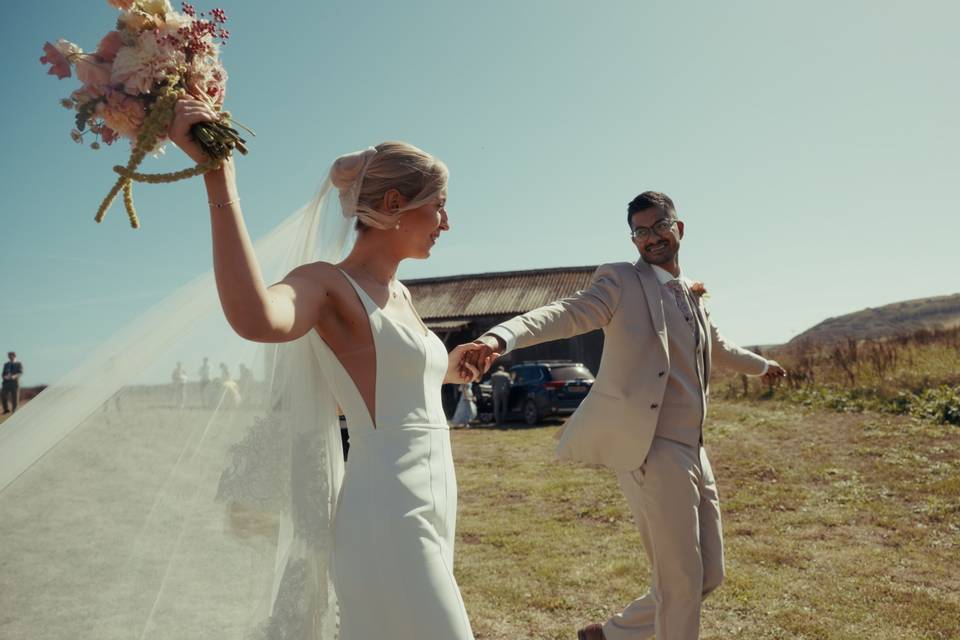 COUPLE CELEBRATING IN FIELD