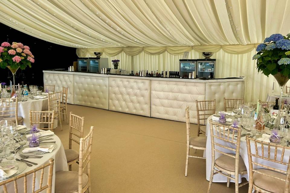 White bar in a wedding marquee