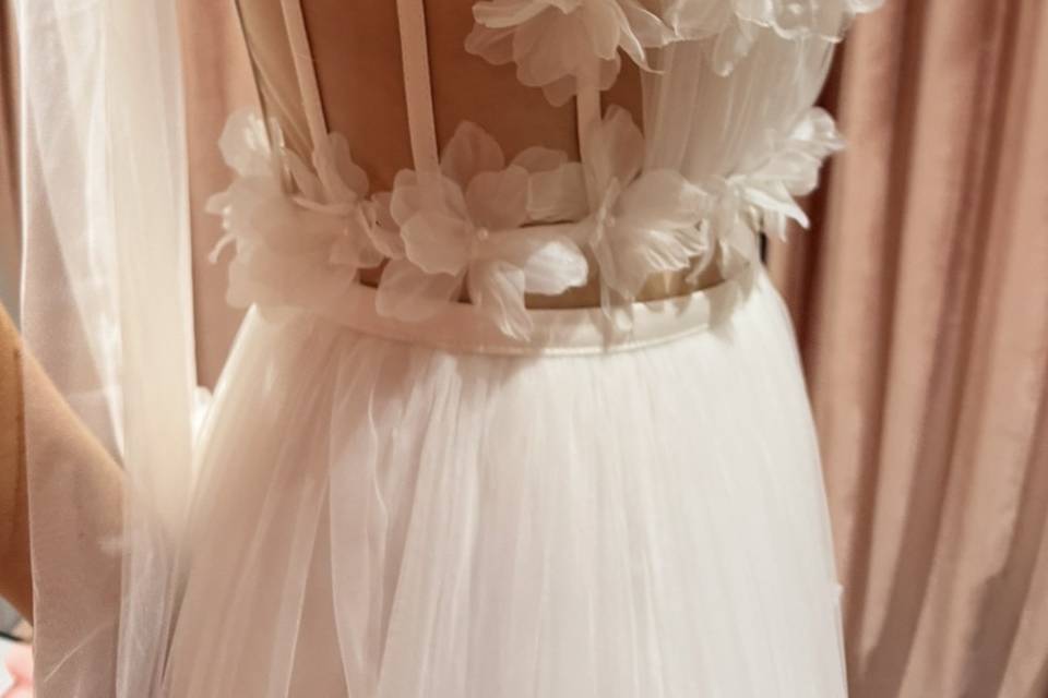 Floral details on a sheer bodice