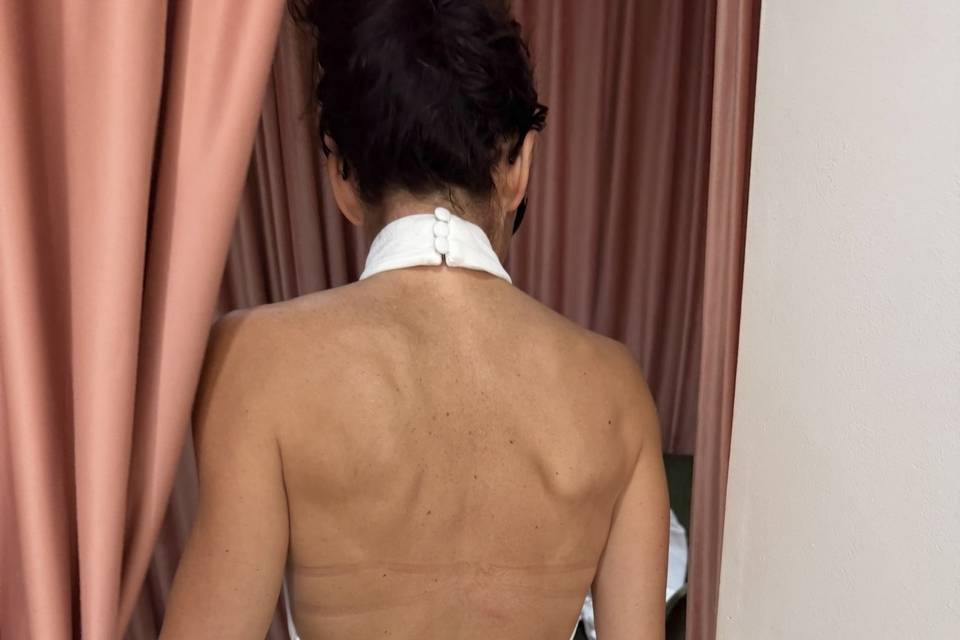 Open-back wedding dress with covered buttons
