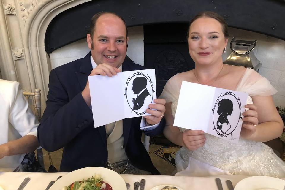 Happy couple holds silhouette