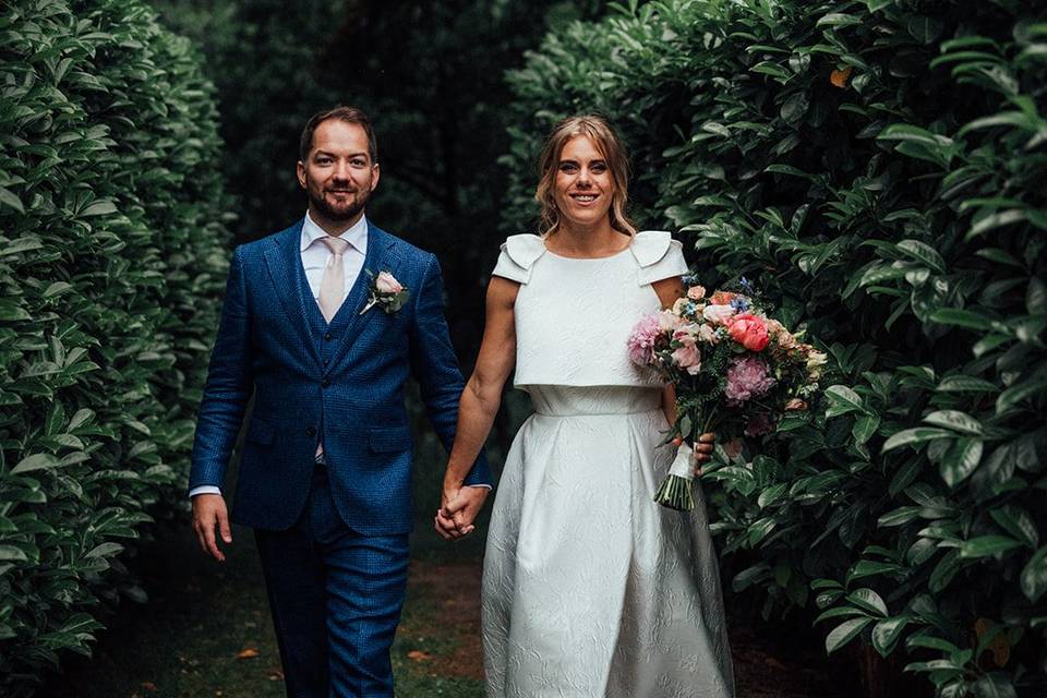 Harriet and Tom walking hand-in-hand