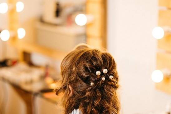 Half up on natural curly hair.