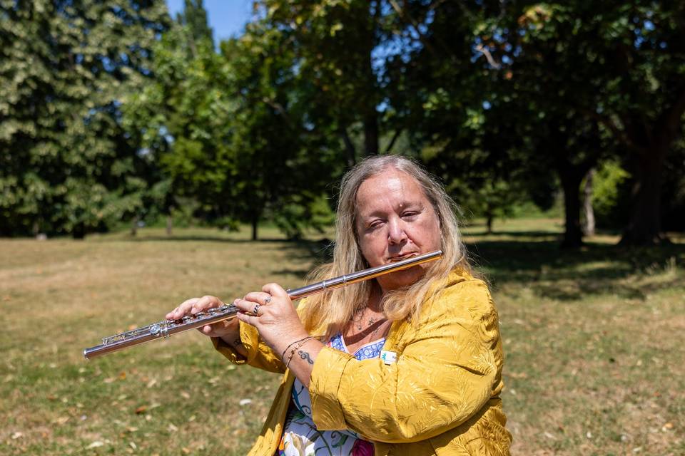 Celebrant playing flute in the garden