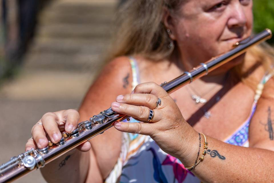 Flautist performing in the garden