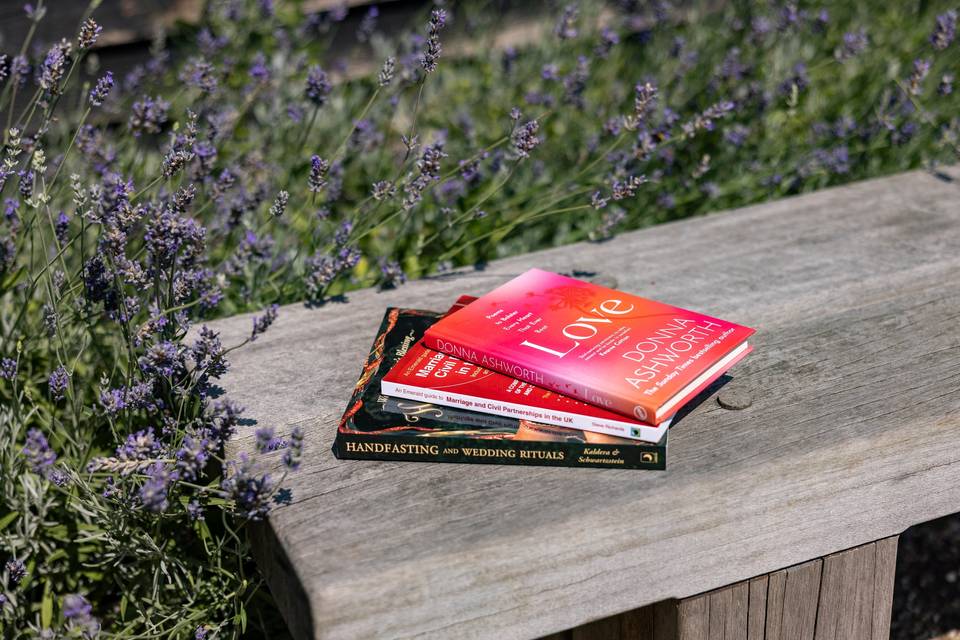 Folder and book on wooden bench