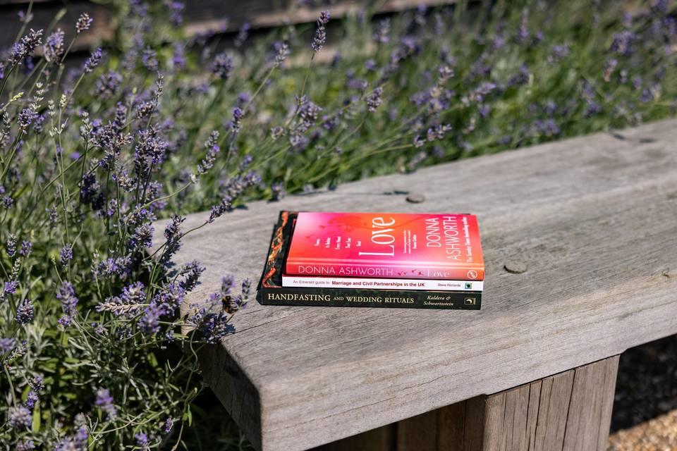 Red ceremony folder on garden bench