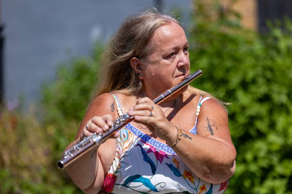 Side profile of garden flautist