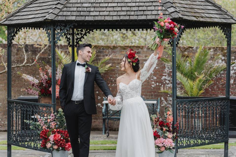 Happy couple outside gazebo