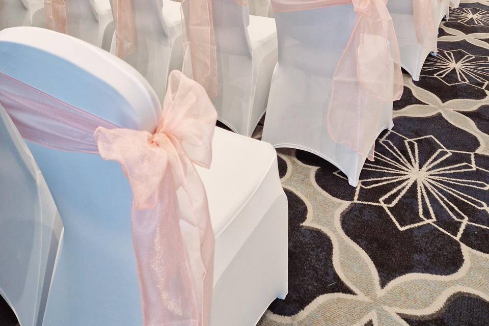 White chair covers and bows