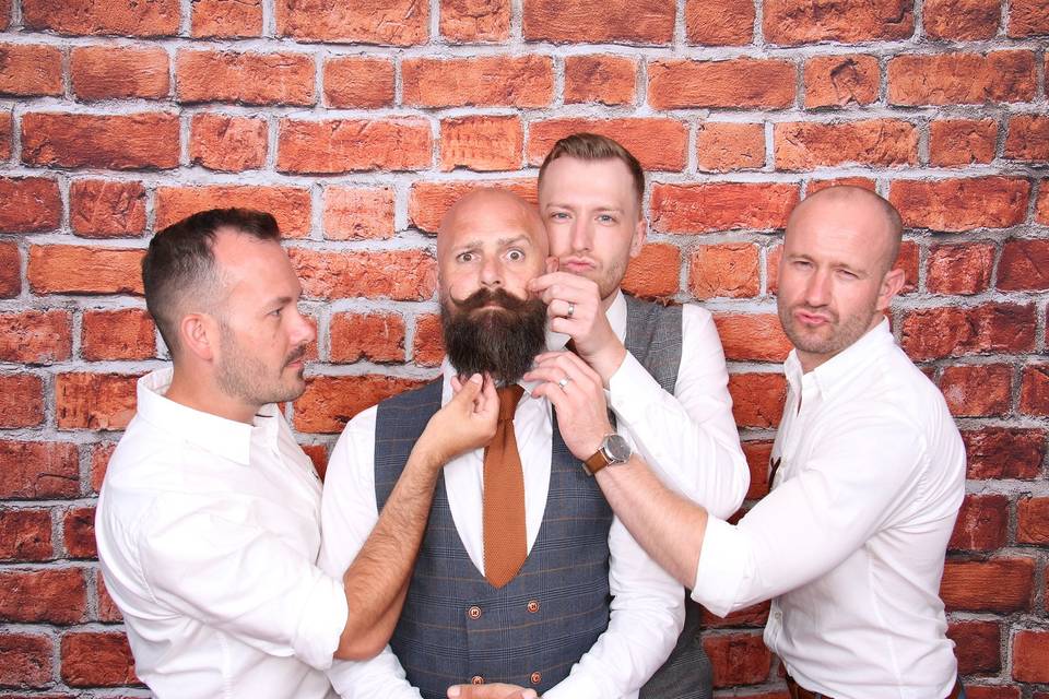 Posing with the grooms