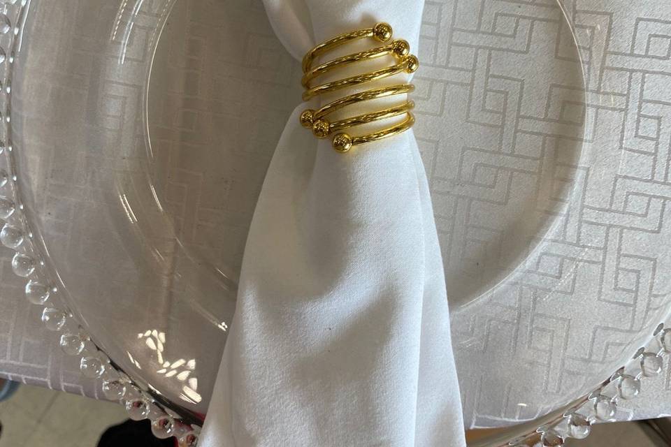 White napkins with gold ring