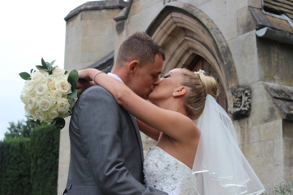 Newlyweds kissing