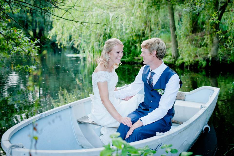 Lucy and Olly in a boat