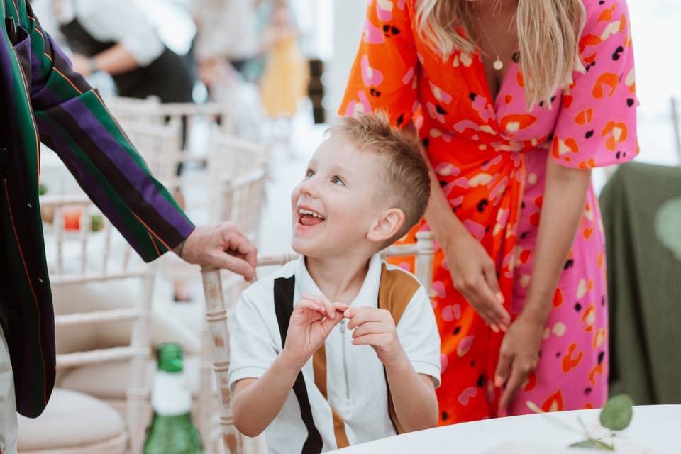 Smiling and sitting at the table