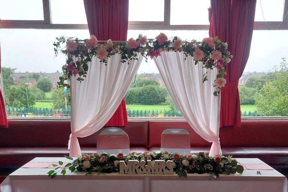 Top table with draped arch