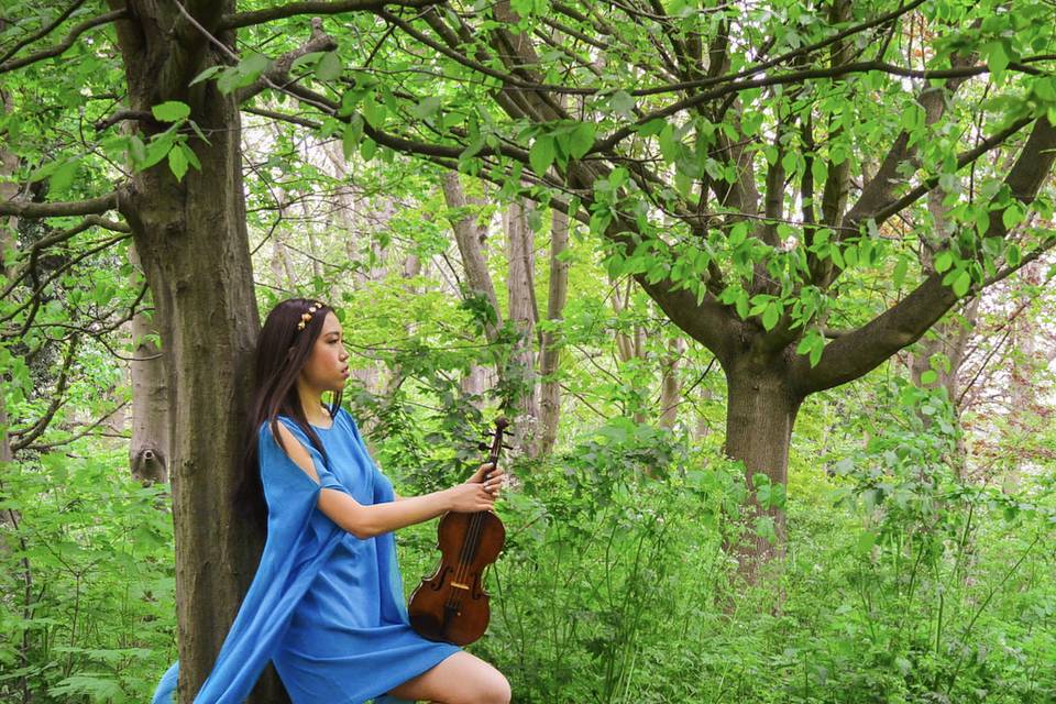 Leaning against a tree