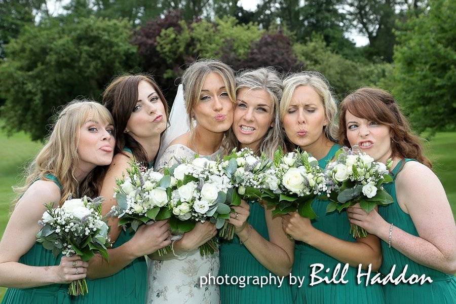 Bride with members of the wedding party - Photography By Bill Haddon