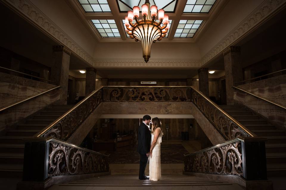 Bride & Groom kiss on stairs