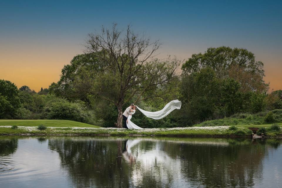 Groom dips his Bride