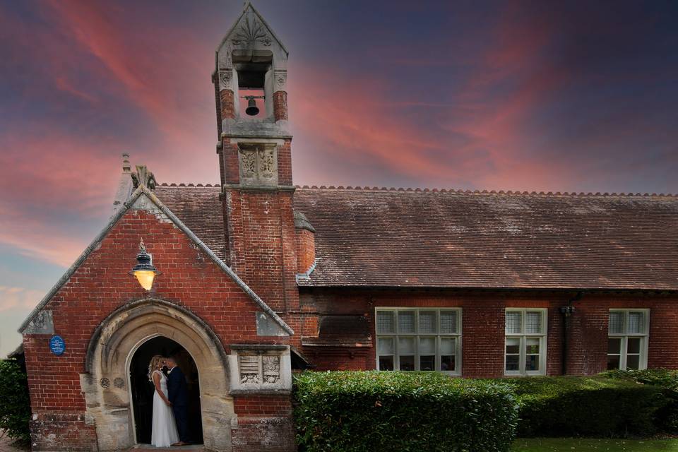 Bride & Groom kiss in entrance