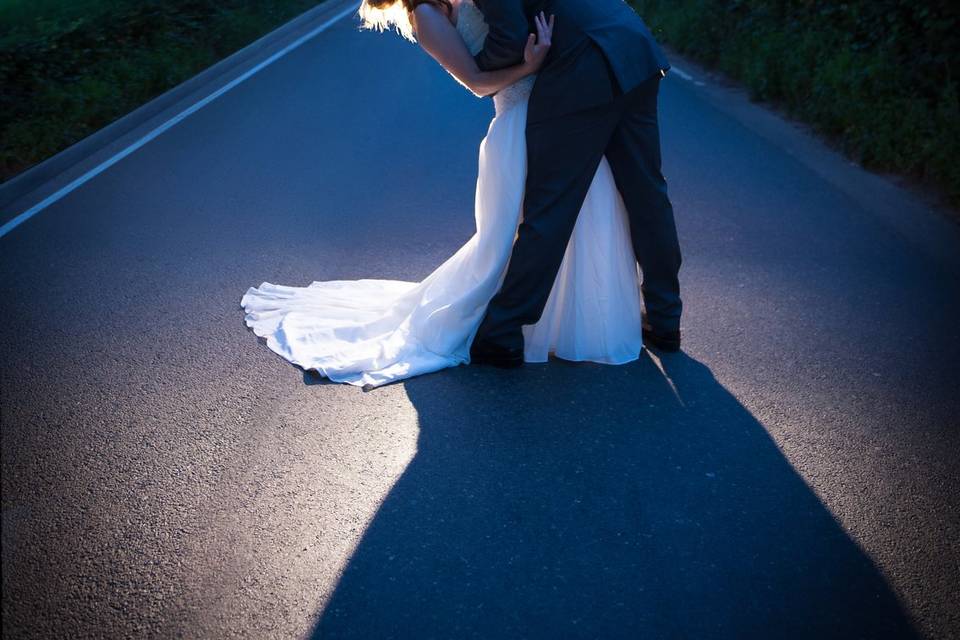 Groom dips and kisses his Brid