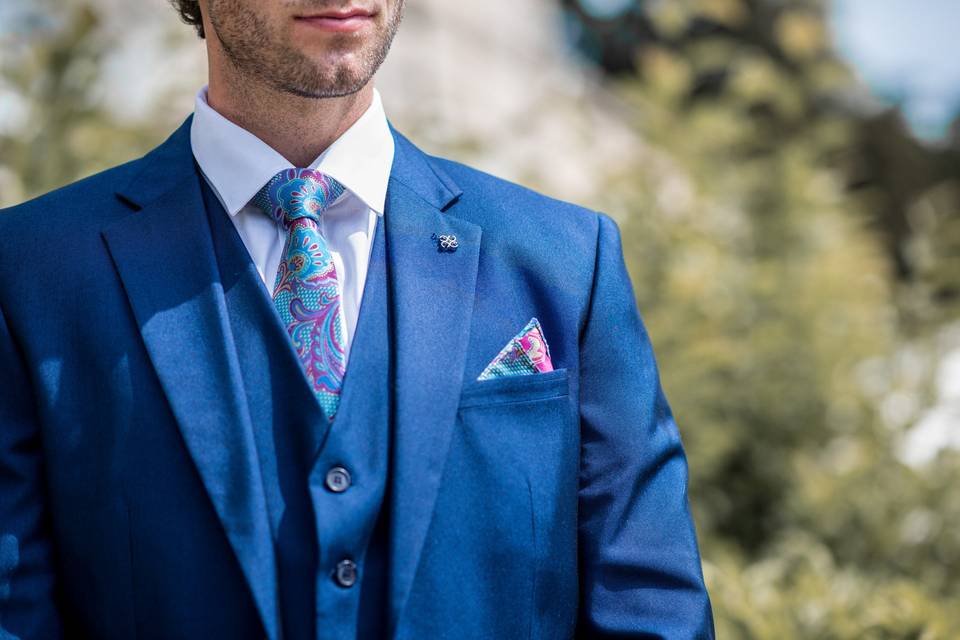Blue suit with colourful tie