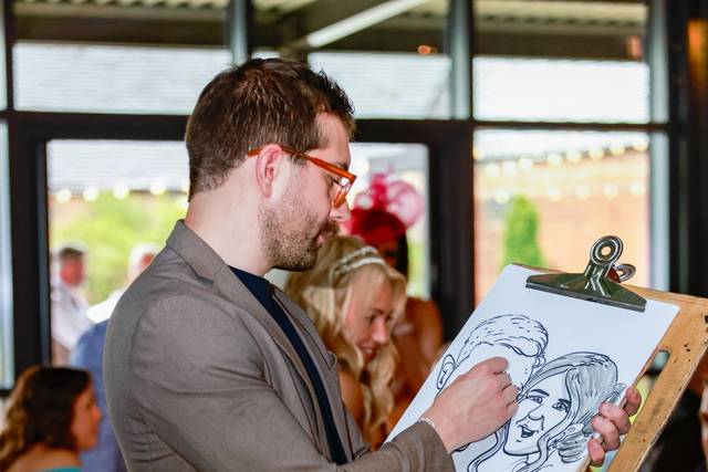 artist drawing caricature at a party