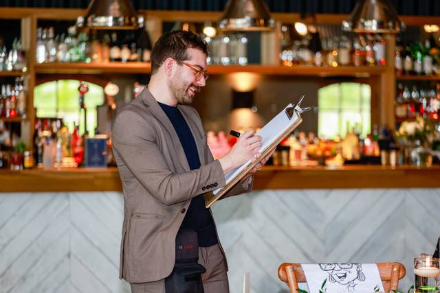 artist drawing caricature in a bar