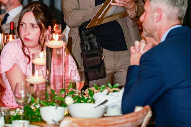 artist drawing for people at a table
