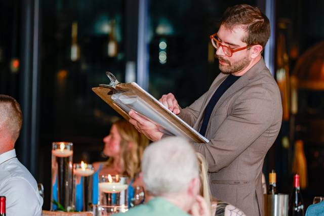artist drawing guests during dinner