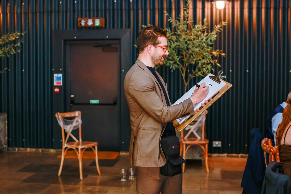 artist in lobby with clipboard